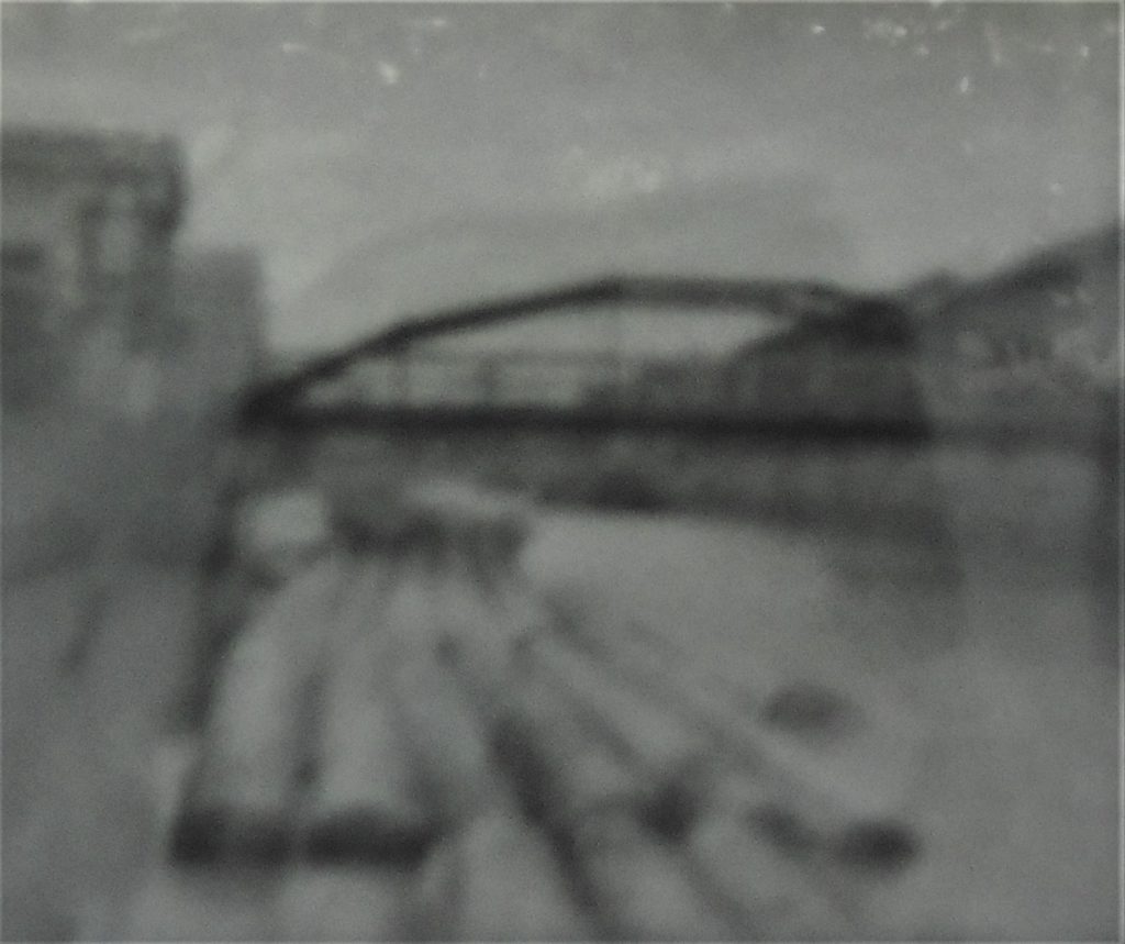 江東区の案内板に掲示されているかつての八幡堀の写真画像。